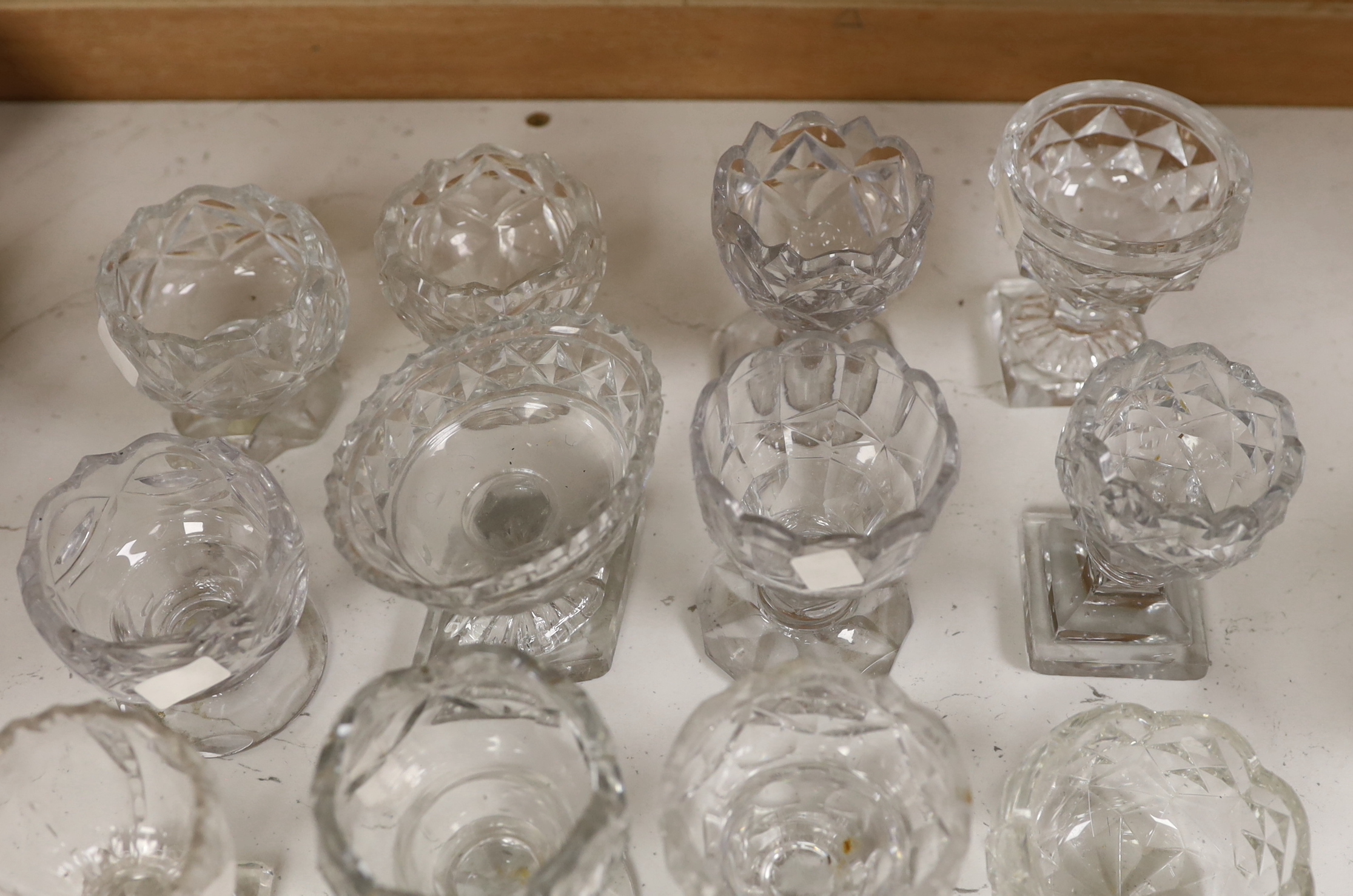 A group of twelve Georgian cut glass salts, tallest 9cm